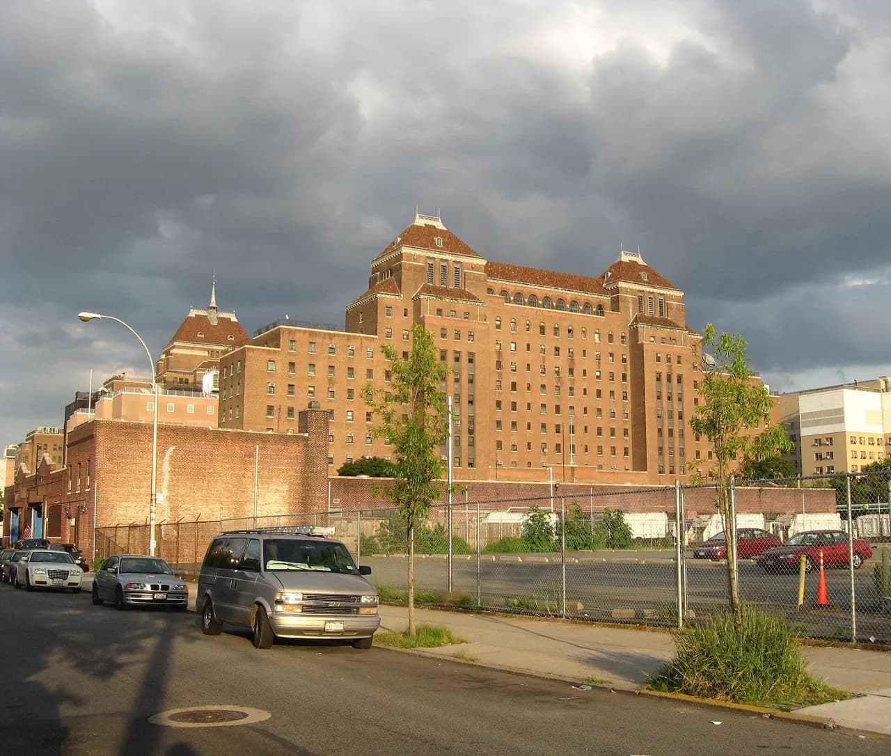 A large brick Kings County Hospital Center building seen from Winthrop Street in Brooklyn