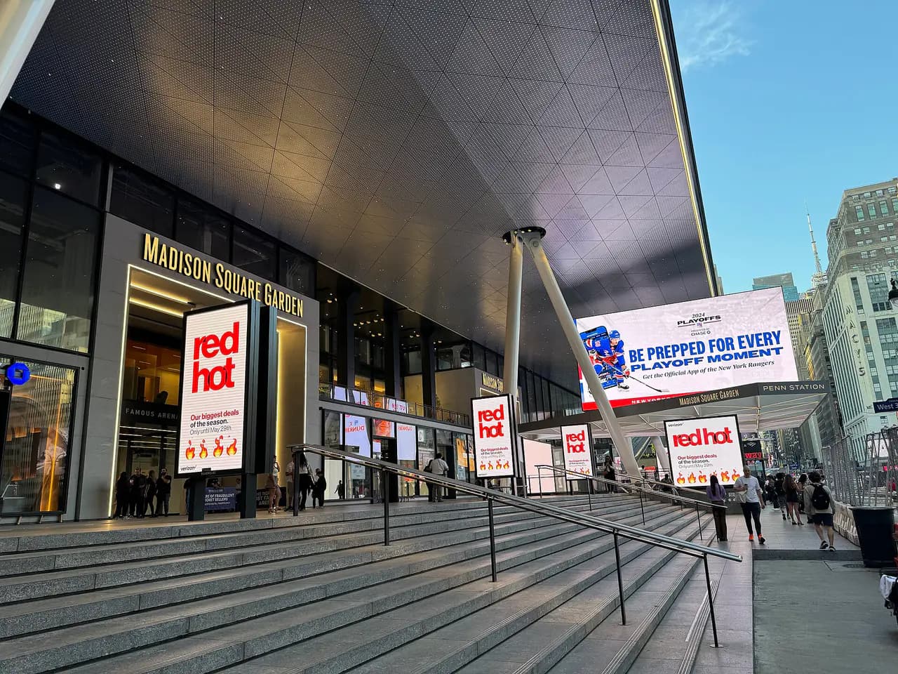 The Seventh Avenue entrance to Madison Square Garden and Penn Station, with wide steps and the Garden's name above the doors