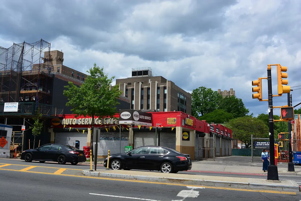 Storefronts along East Fordham Road seen from the corner of Arthur Avenue in the Bronx