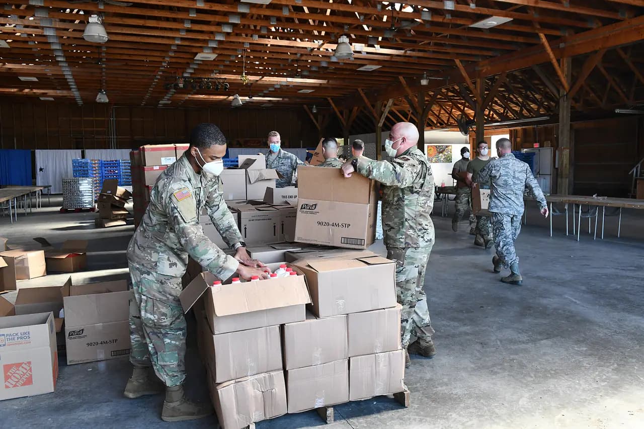 Volunteers packing food boxes at a New York food-distribution site