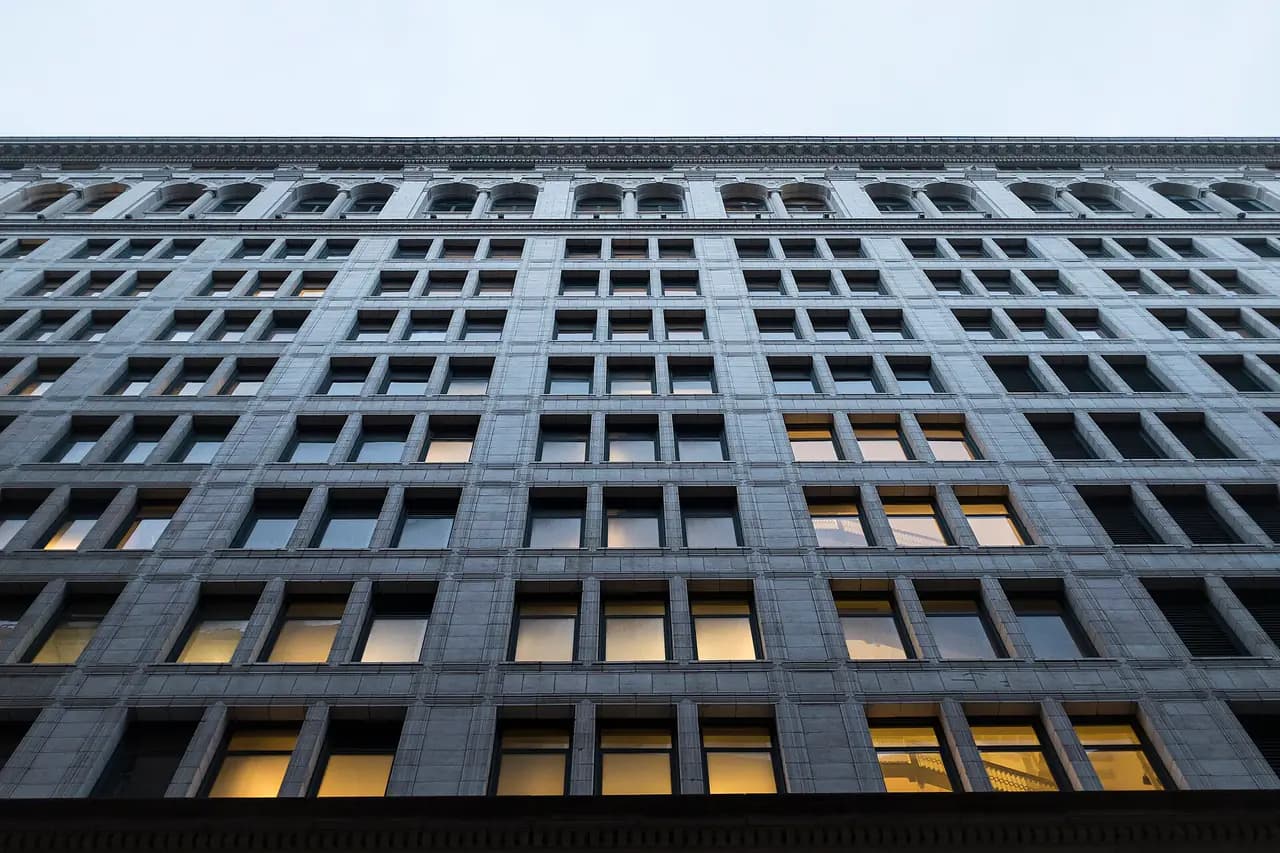 Rows of windows on the facade of 770 Broadway in Manhattan, seen from street level