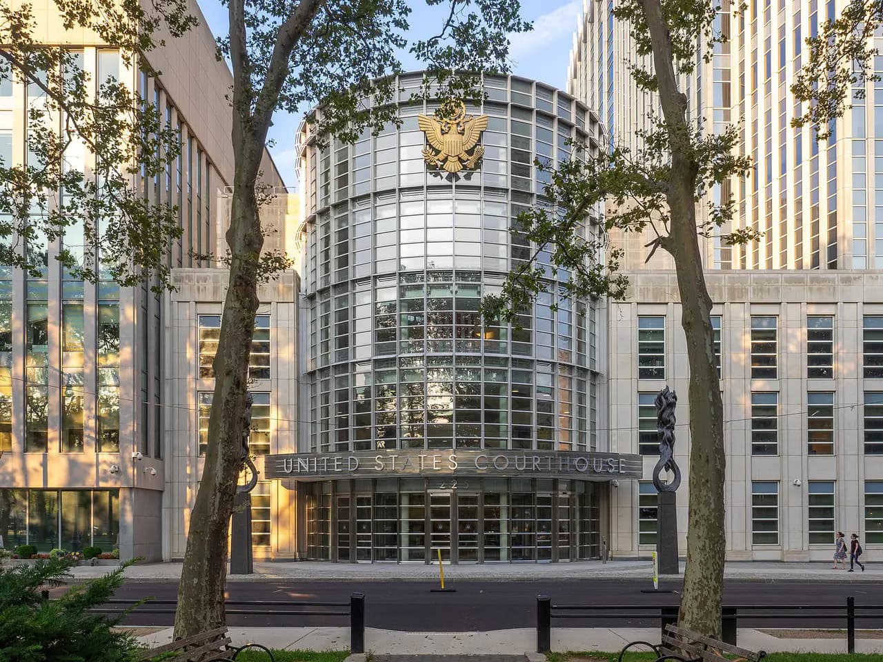 The rounded glass entrance of the United States Courthouse at 225 Cadman Plaza East in Downtown Brooklyn