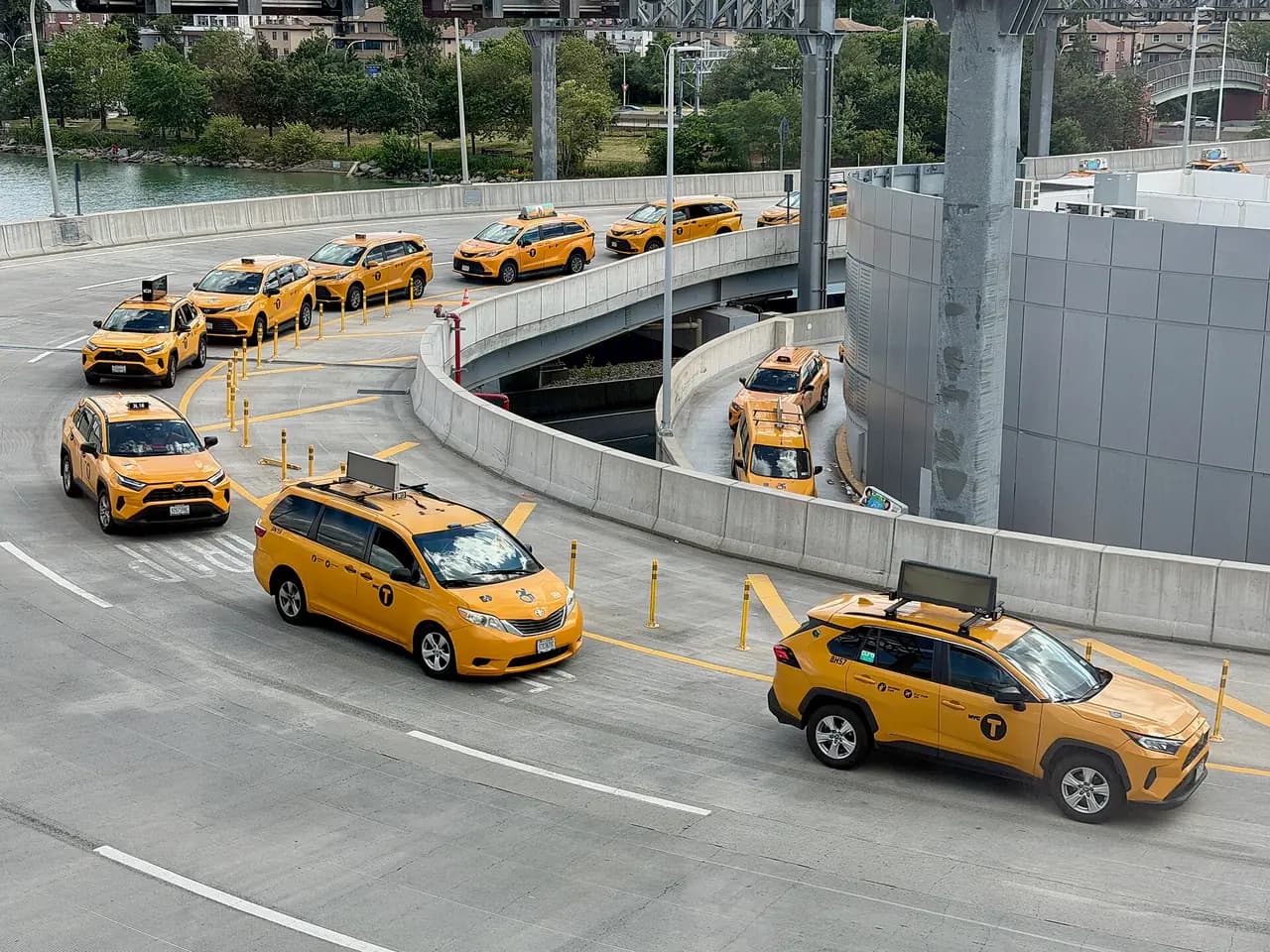 Yellow New York City taxicabs lined up on a city street
